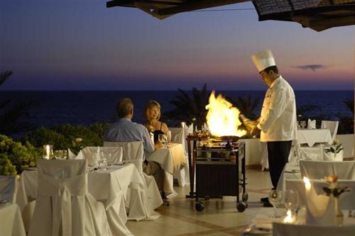 Constantinou Bros Athena Royal Beach Hotel Outdoor Restaurant by Night