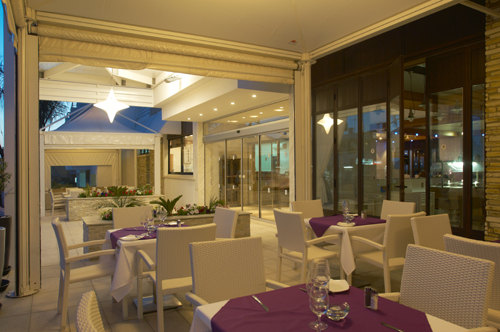 Senator Hotel Apartments Outdoor Restaurant by Night